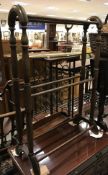 A circa 1900 mahogany drop leaf Sutherland table together with a Victorian style towel rail,