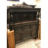 A 17th Century and later oak court cupboard with carved decoration of typical form