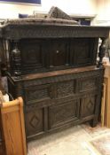 A 17th Century and later oak court cupboard with carved decoration of typical form