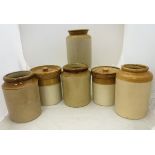 A collection of six stoneware jars,
