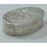 A Continental white metal oval hinged lidded box with engraved decoration,