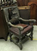 A Victorian oak elbow chair in the 17th Century manner with leather back