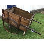 A vintage wooden cart with iron wheels