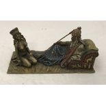 AFTER FRANZ BERGMAN A modern cold painted bronze study of master and slave upon a carpet,