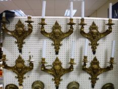 A set of six 19th Century French gilt bronze two branch wall sconces in the Louis XV taste with