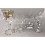 A collection of various drinking glasses to include wines, champagne flutes, martini glasses,