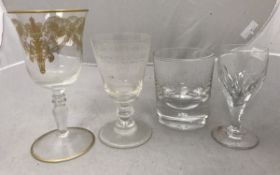 A collection of various drinking glasses to include wines, champagne flutes, martini glasses,