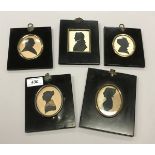 A collection of five 19th Century silhouettes all housed in ebonised frames (three cut out)