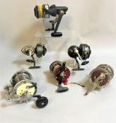 A collection of nine assorted fishing reels to include a Shakespeare Multiplier,