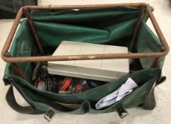 A fisherman's seat box containing a variety of fixed spool and fly reels,