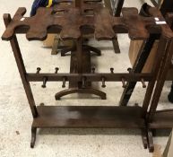 A mahogany boot/whip rack