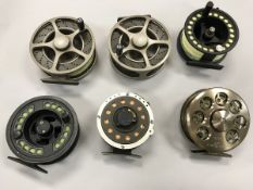 A collection of fly fishing reels to include two Wychwood "Truefly SLA" skeleton fly reels,