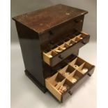 A stained pine collectors' chest of six drawers containing various mineralogical and seashell