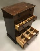 A stained pine collectors' chest of six drawers containing various mineralogical and seashell