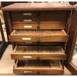 A mahogany cased collector's or microscope slide cabinet with glazed door enclosing ten drawers and