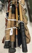 A large collection of assorted fishing rods to include split cane examples of sea rods,