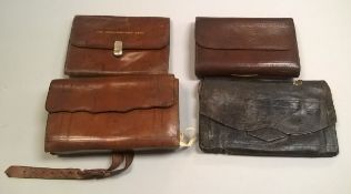 A collection of four leather fly fishers wallets to include a Hardy "Houghton" cast case,