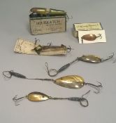 A collection of vintage fishing lures to include a Brown's phantom minnow, a Shurkatch pike bait,