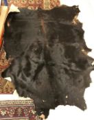 A black Cow pelt