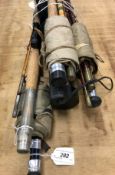 A quantity of assorted fishing rods and other tackle to include a split cane rod,