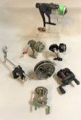 A collection of eighteen assorted fishing reels to include an alloy prototype of an Allcock's