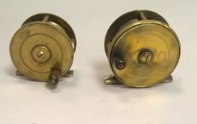 An Allcock 2½" brass plate wind reel and an Allcocks 21/4" brass plate wind reel