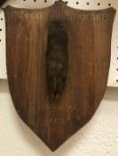 A mounted Fox pad on an oak shield shaped plaque,