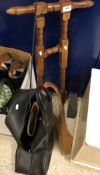 A mahogany boot jack, together with a pair of riding boots (size 38),