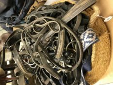 A quantity of polo tack including overgirths, reins,