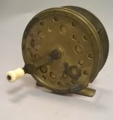 An unnamed folding handle 4½" diameter brass crank wind salmon fly reel,