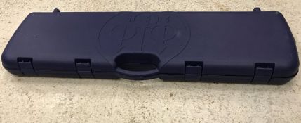 A Beretta hard plastic motor case and cleaning rod