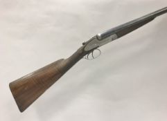 A William Powell & Son 12 bore shotgun double barrel side by side, side lock ejector,