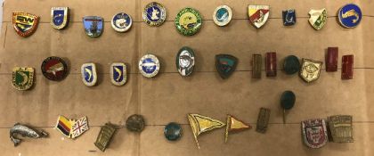 A collection of 35 Continental enamelled fishing club badges