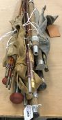 A collection of assorted split cane and tubular steel fishing rods to include examples by Milwards,