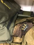 A Barbour waterproof jacket, a Sierra fishing jacket, an Orvis fly fisher's jacket,