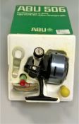 An ABU 506 closed faced fishing reel complete with makers box and accessories