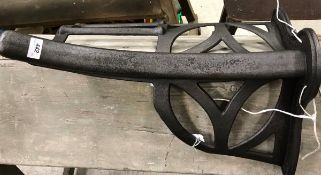 A cast iron wall-mounted side-saddle rack inscribed "Musgraves Pattern,