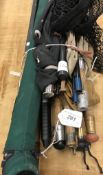 A collection of assorted fishing rods and miscellaneous tackle to include split cane spinning rods,