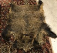 A Wild Boar pelt and Goat skin rug