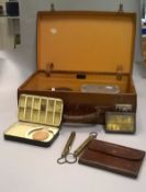 A leather attache case containing a Hardy japanned "Test (Montagu)" fly case,