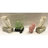 A pair of hard stone sculptures of horse's heads on marble bases,