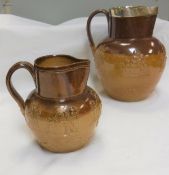 A Victorian Doulton Lambeth Harvest jug with silver rim and another smaller Harvest jug