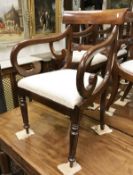 A set of eight (6 + 2) Victorian mahogany bar back dining chairs with drop in seats on turned and