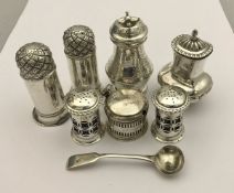 A George III silver pepper of baluster form with engraved floral decoration (London 1802),