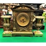 A 19th Century French brass cased clock garniture,