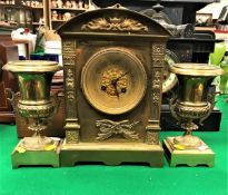 A 19th Century French brass cased clock garniture,