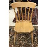 A set of eight stained beech slat back chairs