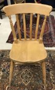 A set of eight stained beech slat back chairs