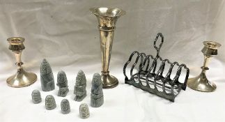 A box of sundry items to include a pair of silver candlesticks, a silver vase, soapstone chess set,