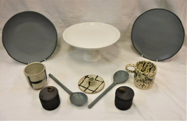 A pair of Daylesford grey glazed pottery plates and spoons, a White Company mince pie / cake stand,